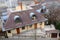 BUDAPEST, HUNGARY - DECEMBER 22, 2017: Modern house with a tiled roof, attic windows and chimney system.