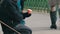 Budapest, Hungary - December 6, 2018: A hungry beggar woman sits on her lap next to a cane and beg for the alms