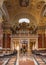 Budapest, Hungary - Feb 8, 2020: Organ pipe facade with golden fresco ceiling in St. Stephen`s Basilica