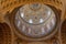 Budapest, Hungary - Feb 8, 2020: Upward view of gilded golden dome cupola inside St. Stephen`s Basilica