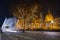 Budapest, Hungary - Festively decorated light tram Fenyvillamos on the move with Parliament of Hungary at Kossuth square by nigh