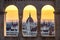 Budapest, Hungary - The Hungarian Parliament building at sunrise looking through old stone windows