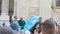 Budapest / Hungary - July 29 2019: Free walking tours guide in Budapest with blue umbrella talking with interested group of people