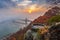 Budapest, Hungary - Lookout on Gellert Hill with Liberty Bridge Szabadsag Hid, fog over River Danube, colorful sky and clouds