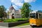 Budapest, Hungary - May 29, 2015: Tram passes outside the Hungarian Parliment building in Budapest.