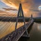 Budapest, Hungary - Megyeri Bridge over River Danube at sunset with heavy traffic, beautiful dramatic clouds