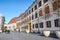 Budapest, Hungary - Nov 6, 2019: Cobbled street in the Castle District with the building of the Court Theatre of Buda. Budapest