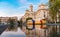 BUDAPEST, HUNGARY - OCTOBER 27, 2015: Budapest Parliament Square with Fountain water, moving tram, people and reflection.