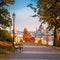 Budapest, Hungary - Romantic sunrise scene at Buda district with bench, lamp post, autumn foliage, Szechenyi Chain Bridge