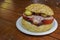 Budapest, Hungary street food market with pork sandwich on table. Open air seasonal stalls with traditional Hungarian comfort food