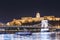 Budapest National Gallery and Szechenyi Chain Bridge at night from Danube river