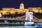 Budapest National Gallery and Szechenyi Chain Bridge at night from Danube river