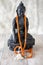 Buddah statue with orange beads for reading mantras