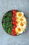 Buddha bowl with bulgur, green beans, cherry tomatoes and boiled egg halves.