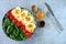 Buddha bowl with bulgur, green beans, cherry tomatoes and boiled egg halves.