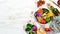 Buddha bowl: chickpeas, avocados, broccoli, paprika, green peas, tomatoes. Vegetable salad. Top view.