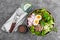 Buddha bowl dish with buckwheat porridge, boiled egg, fresh vegetable salad of radish, cucumber, lettuce and chard leaves. Healthy