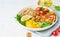 Buddha bowl with halloumi, salad lettuce, quinoa, vegetarian menu, white background, closeup with copy space