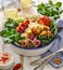 Buddha bowl of mixed vegetables,tofu cheese and groats. Healthy and nutritious vegan meal.