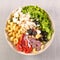 Buddha bowl with pasta, feta cheese, tomato