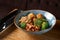 Buddha bowl with quinoa, broccoli and tofu sauce with mushrooms.