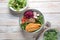 Buddha bowl with red cabbage, tomatoes, radish, arugula beet leaves, pea shoots, buckwheat, grilled chicken