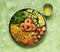 Buddha bowl salad with grilled shrimp, fresh vegetables and herbs. Ð¡lean eating, top view.