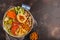 Buddha bowl with vegetables, mushrooms, bulgur, hummus and baked