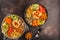 Buddha bowls with vegetables, mushrooms, bulgur, hummus and bake