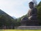 Buddha bronze statue and monk, Sinheungsa temple, South Korea