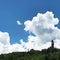 Buddha Dordenma Statue on Top of a Treelined Hill with Clouds, Thimphu, Bhutan