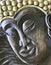 Buddha face executed with antique style, wood carving. Handmade, bas-relief wooden