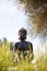 Buddha figurine in the middle of green meadow