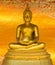 Buddha gold statue on golden background patterns Thailand.