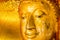 Buddha gold statue on golden background patterns Thailand.