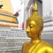 Buddha gold statue on golden background Thailand