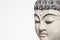 Buddha Head Meditating On A White Background