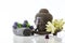 Buddha head on a white background, towel, stones and lotus