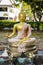 Buddha holding a sphere ball globe seated in lotus posture