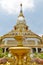 Buddha image on decorating fountain in in front of Phra Maha Chedi Chai Mongkol, Roi Et province, northeastern Thailand