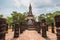 Buddha image in front of pagoda.