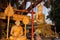 Buddha image and holy man sitting under Bodhi tree