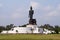 Buddha image standing on blue sky background