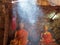 Buddha image statue inside cave with light smoke as travel peaceful place