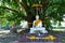 Buddha image under the big Bodhi tree in Wat Phra Sri Mahathat, Bang Khen, Bangkok, Thailand, 28 November 2021