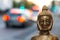 Buddha with lights of road traffic