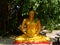 Buddha meditating under a banyan tree.