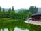 Buddha prayer wheels gallery near a lake