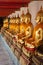 Buddha sitting in line and meditating Wat Pho temple , Bangkok,