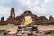 Buddha statue and broken pagoda at Wat Mahathat